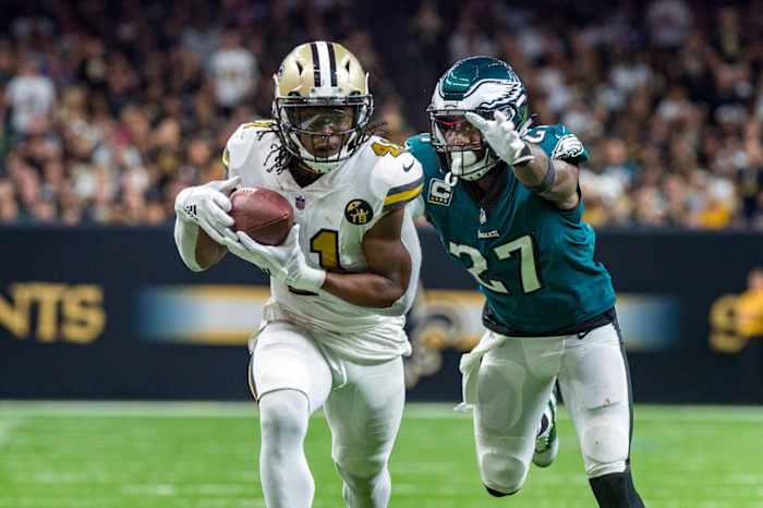 New Orleans Saints running back Alvin Kamara (41) runs the ball against Eagles safety Malcolm Jenkins (27). Mandatory Credit: Scott Clause/The Advertiser via USA TODAY NETWORK